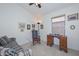 Cozy living room featuring a rocking chair, desk, and window for natural light at 9837 W Tonopah Dr, Peoria, AZ 85382