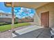 View of backyard with artificial grass from covered outdoor patio with secure metal door at 9837 W Tonopah Dr, Peoria, AZ 85382