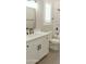 Bathroom with double sink vanity, marble countertops, and a tub shower with white tile at 1228 N 106Th Pl, Mesa, AZ 85207