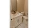 Bathroom featuring white vanity, decorative tile flooring, and black hardware at 1228 N 106Th Pl, Mesa, AZ 85207