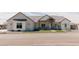 Charming home featuring a welcoming entrance and beautifully manicured artificial lawn at 1228 N 106Th Pl, Mesa, AZ 85207