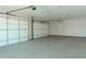 Spacious two-car garage with high ceilings and white doors at 1228 N 106Th Pl, Mesa, AZ 85207