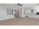 Open-concept living space showcasing the seamless flow into the kitchen area at 1228 N 106Th Pl, Mesa, AZ 85207