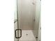 Walk-in shower with glass door and grey subway tile surround, with hexagon tile flooring at 1228 N 106Th Pl, Mesa, AZ 85207