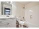 Bright bathroom featuring a tub shower, modern vanity, mirror and updated fixtures at 12333 W Marshall Ave, Litchfield Park, AZ 85340