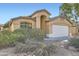 Single-Gathering home featuring an attached two-car garage and traditional stucco architecture at 12333 W Marshall Ave, Litchfield Park, AZ 85340