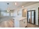 Modern kitchen with a center island, seamlessly connected to a spacious living area with a ceiling fan at 12333 W Marshall Ave, Litchfield Park, AZ 85340