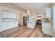 Bright kitchen featuring white cabinets, a center island with pendant lighting, and stainless steel appliances at 12333 W Marshall Ave, Litchfield Park, AZ 85340