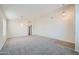 Open-concept living room featuring plush carpeting and neutral walls, perfect for relaxing or entertaining at 12333 W Marshall Ave, Litchfield Park, AZ 85340