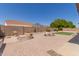 Lush backyard featuring brick landscaping, comfortable seating, and privacy for outdoor relaxation at 13196 W Coronado Rd, Goodyear, AZ 85395