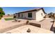 Spacious backyard showcasing the home's exterior and landscaped entertainment space at 13196 W Coronado Rd, Goodyear, AZ 85395