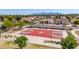 Community basketball court with mountain views, adjacent to a park with mature trees at 13196 W Coronado Rd, Goodyear, AZ 85395