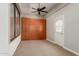 This room boasts natural light, a full wall of storage, and a door to the outdoor living space at 13196 W Coronado Rd, Goodyear, AZ 85395