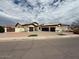 Single story home featuring a three car garage and low maintenance landscaping at 13196 W Coronado Rd, Goodyear, AZ 85395