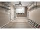 This bright garage has ample built-in storage, creating a clean and organized space at 13196 W Coronado Rd, Goodyear, AZ 85395