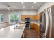 Bright kitchen with stainless steel appliances and a sink with window view at 13196 W Coronado Rd, Goodyear, AZ 85395