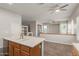 Bright and spacious kitchen with large island, sink, and view of the living area at 13196 W Coronado Rd, Goodyear, AZ 85395