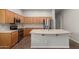 Well-equipped kitchen showcasing stainless steel appliances and center island at 13196 W Coronado Rd, Goodyear, AZ 85395