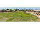 Expansive park area featuring a playground, walking paths, shaded picnic areas, and community space for various activities at 13196 W Coronado Rd, Goodyear, AZ 85395