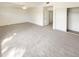Spacious bedroom with neutral carpet, closet, and ceiling fan at 1360 E Washington Ave, Gilbert, AZ 85234