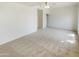 Large bedroom with neutral carpet, ceiling fan, closet, and a connecting door at 1360 E Washington Ave, Gilbert, AZ 85234