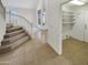 Grand entryway showcasing staircase, high ceilings, and a convenient storage room at 1360 E Washington Ave, Gilbert, AZ 85234