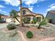 Charming two-story home with mature palm trees and landscaped yard at 1360 E Washington Ave, Gilbert, AZ 85234