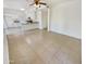 Bright living room with tile floors and a view into the kitchen at 1360 E Washington Ave, Gilbert, AZ 85234