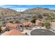 Picturesque aerial view of a vibrant community nestled among stunning desert mountain scenery at 15437 S 23Rd Pl, Phoenix, AZ 85048