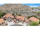 Picturesque aerial view of a vibrant community nestled among stunning desert mountain scenery at 15437 S 23Rd Pl, Phoenix, AZ 85048