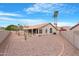 Private backyard featuring desert landscaping and a covered patio, perfect for outdoor entertaining at 15437 S 23Rd Pl, Phoenix, AZ 85048