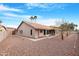 Charming backyard features desert landscaping and a covered patio perfect for relaxing outdoors at 15437 S 23Rd Pl, Phoenix, AZ 85048