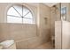 Elegant walk-in shower featuring stylish tilework and a built-in bench at 15437 S 23Rd Pl, Phoenix, AZ 85048
