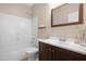 Bright bathroom with a white bathtub, tiled shower, and a modern vanity with mirror at 15437 S 23Rd Pl, Phoenix, AZ 85048