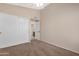 Bedroom featuring a ceiling fan, closet and bathroom access at 15437 S 23Rd Pl, Phoenix, AZ 85048