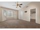 Bright bedroom with large windows and a ceiling fan, offering plenty of natural light at 15437 S 23Rd Pl, Phoenix, AZ 85048