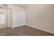Neutral bedroom featuring carpeted floors and a closet with sliding doors at 15437 S 23Rd Pl, Phoenix, AZ 85048
