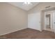 Cozy bedroom featuring a ceiling fan and closet for efficient climate control and storage at 15437 S 23Rd Pl, Phoenix, AZ 85048