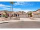 Charming single-story home featuring a desert landscape, tile roof, and a two-car garage at 15437 S 23Rd Pl, Phoenix, AZ 85048