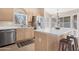 Kitchen with stainless steel appliances, bright cabinets, and neutral countertops at 15437 S 23Rd Pl, Phoenix, AZ 85048