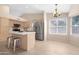 Bright kitchen with stainless appliances, neutral countertops, and center island at 15437 S 23Rd Pl, Phoenix, AZ 85048