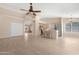 Open-concept living room and kitchen featuring tile floors and stainless steel appliances at 15437 S 23Rd Pl, Phoenix, AZ 85048