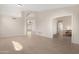 Open living room featuring neutral walls and tile flooring throughout the space at 15437 S 23Rd Pl, Phoenix, AZ 85048