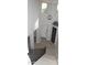 Bright entryway boasts wood-look floors and a modern chandelier, creating an inviting atmosphere at 15620 W Cameron Dr, Surprise, AZ 85379