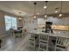 Bright, open kitchen with granite countertops, stainless steel appliances, and a breakfast bar at 15620 W Cameron Dr, Surprise, AZ 85379