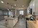 Well-appointed kitchen with granite countertops, stainless steel appliances, and an open layout at 15620 W Cameron Dr, Surprise, AZ 85379