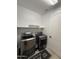 Well-lit laundry room featuring modern washer and dryer and plenty of space at 15620 W Cameron Dr, Surprise, AZ 85379