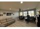 Bright and airy home office with dual workstations, a comfortable sofa, and inspiring decor, creating a productive atmosphere at 15620 W Cameron Dr, Surprise, AZ 85379
