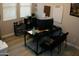 Office with a black desk, whiteboard, rolling chairs, and large computer monitor at 15620 W Cameron Dr, Surprise, AZ 85379