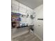 Pantry with ample storage shelves and laundry bag, offers efficient organization at 15620 W Cameron Dr, Surprise, AZ 85379